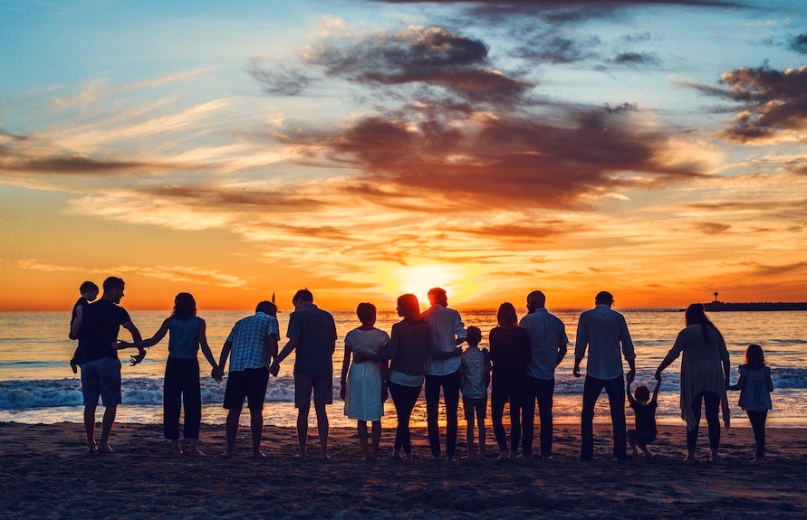 Family on the beach at sunset — leaving a legacy