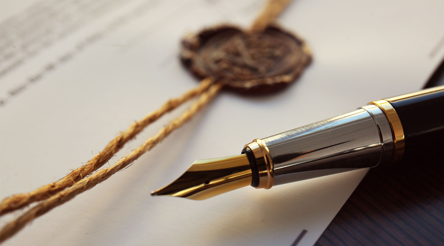 Fountain pen and wax seal on estate planning documents
